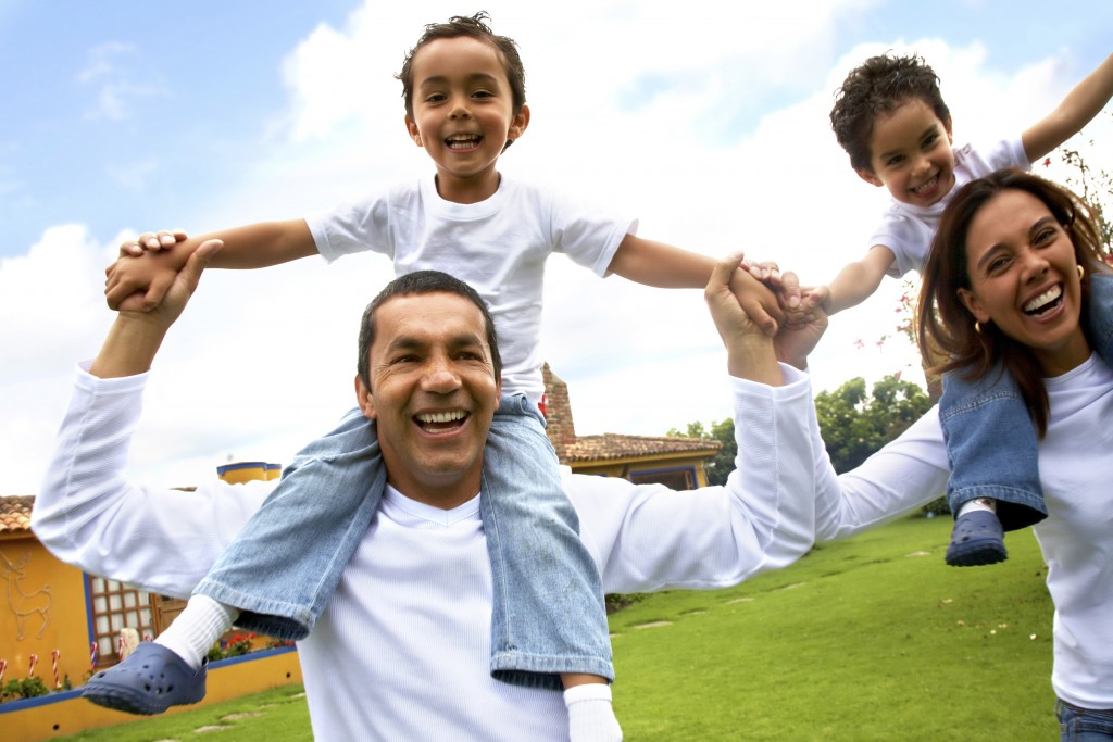 Family on a trip, smiling together outdoors