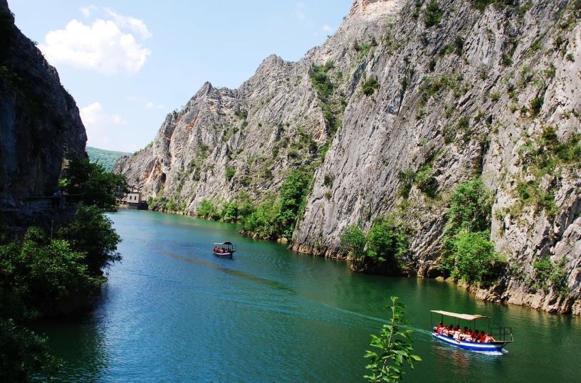 Two rowing boats surrounded with nature 