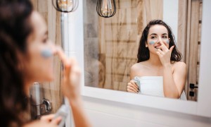 Woman doing her morning beauty routine