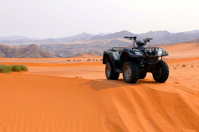 ATV on the red dunes in Namibia