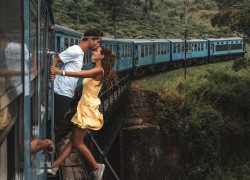 Girl and a boy kissing in train