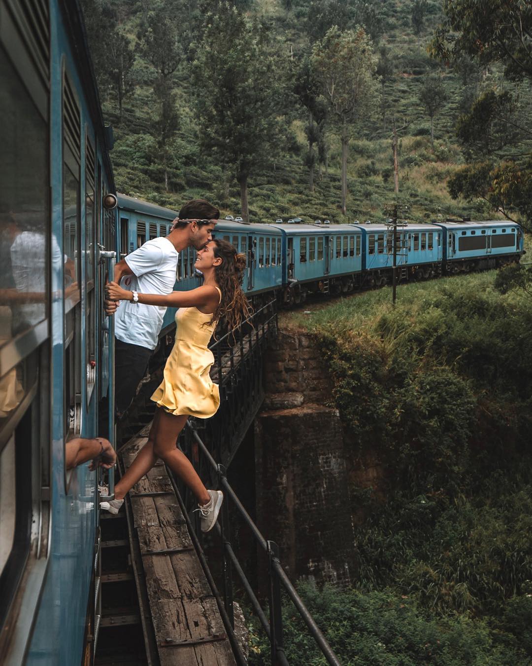 Girl and a boy kissing in train