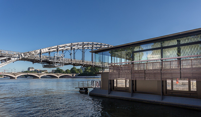 Moder floating hotel with a view on a river and bridges