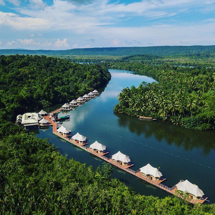 Floating hotels on a river with a nice nature around