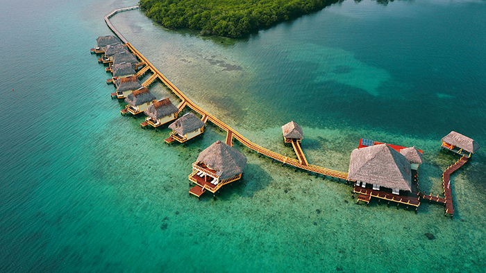 Floating hotel lodges put all next to each other over the sea