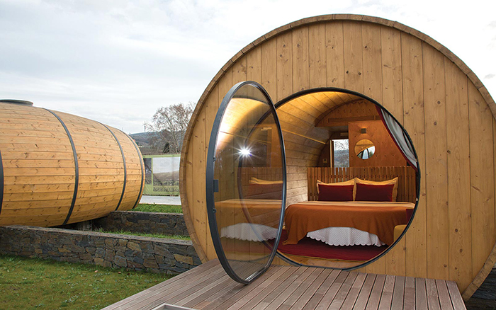 Giant wine barrel room with a glass door