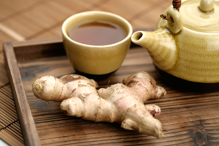 Ginger tea served in a nice mug and tea kettle