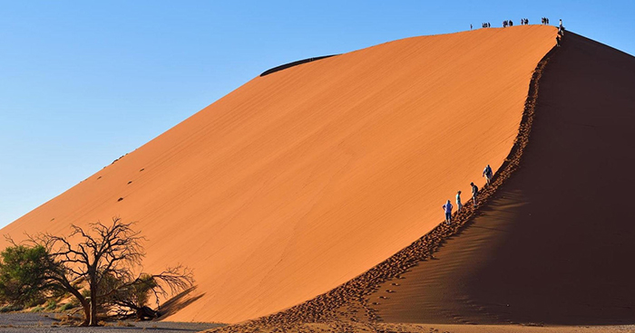 People walking around a desert in Namibia