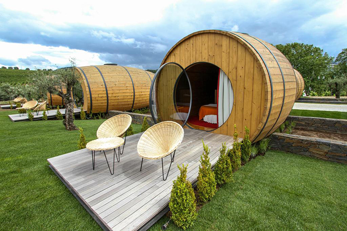 The wine barrel rooms with their small balconies in front and surrounded with good nature