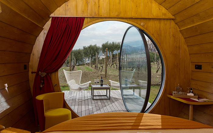 The interior of Quinta Da Pacheca rooms with open window looking at the front yard 