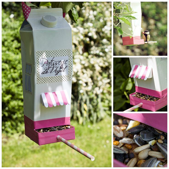 Recycled plastic bottle bird house hanging on a tree