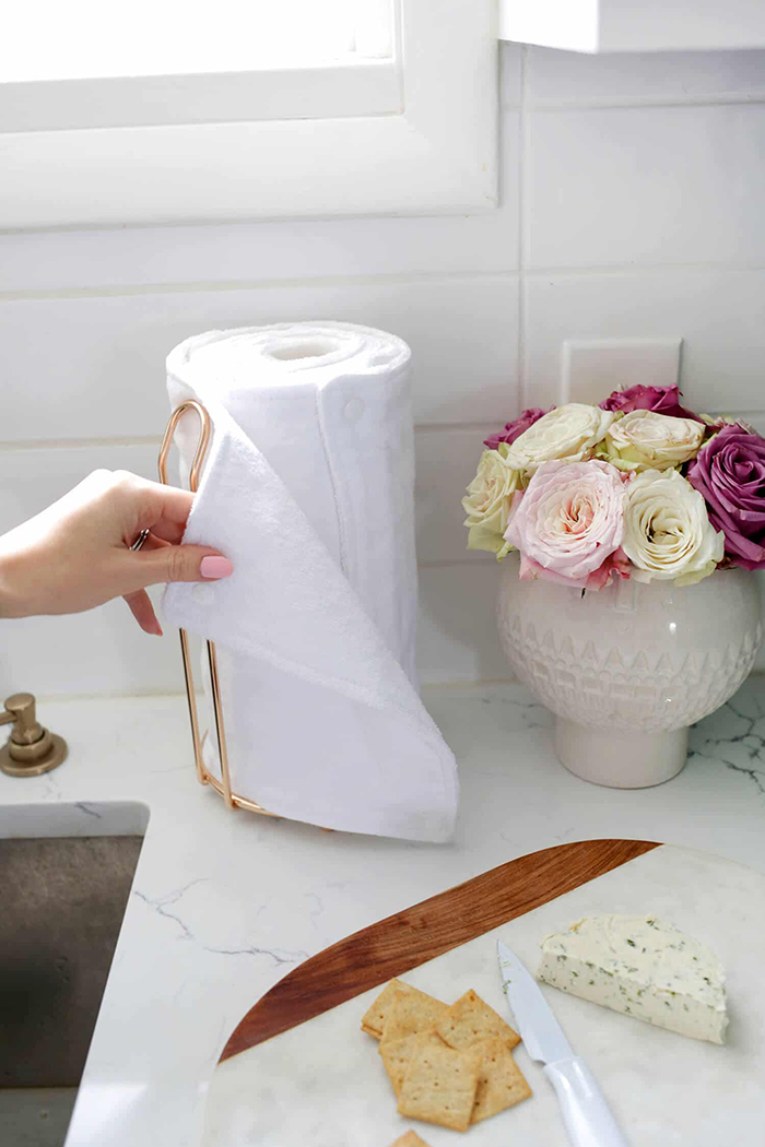 Reusable kitchen paper and flowers next to it