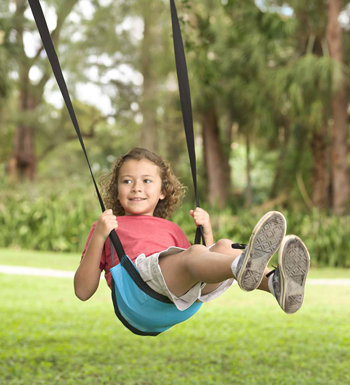 Little girl on a sling swing