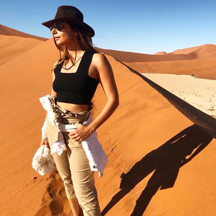 Woman posing in beautiful red dunes