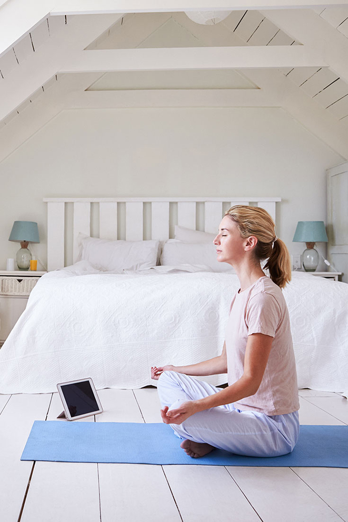 Girl doing yoga indoors