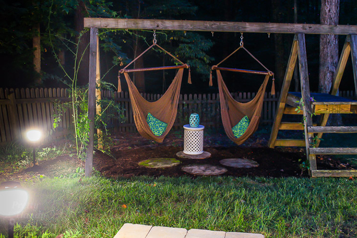 Swing sets in the patio on a summer night with peaceful lighting