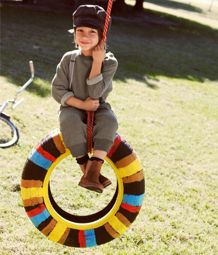 Girl on a tire swing 