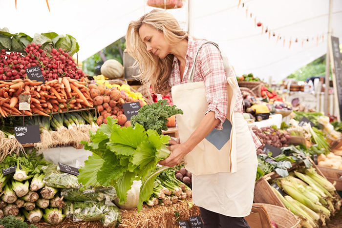 Woman doing groceries with reusable bag