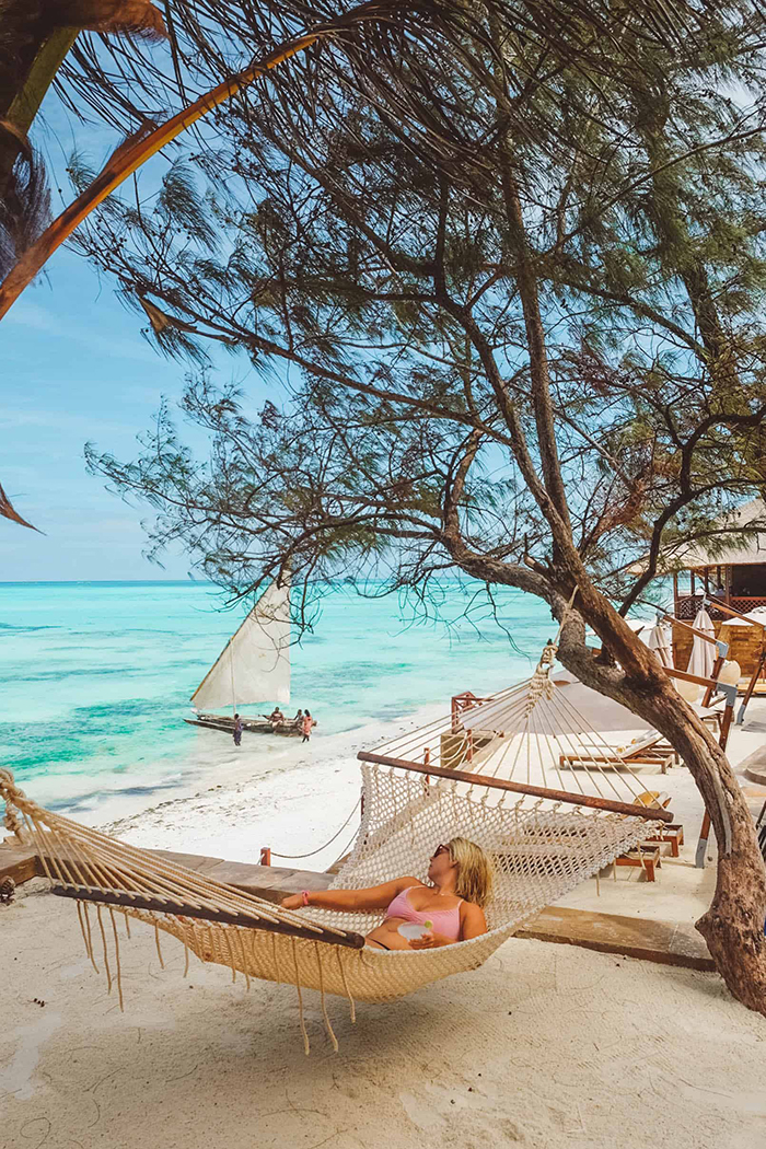 Woman in a hammock at the beach