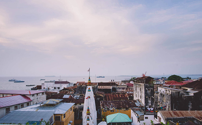 Colorful buildings and the sea behind them