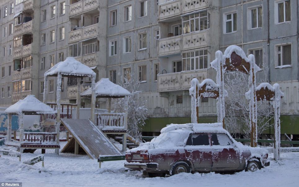 Frozen isolated car put in a kids' park with everything in ice around