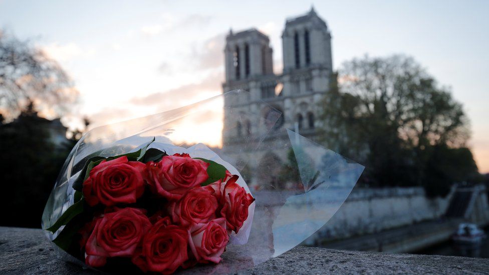 Flowers laid outside Notre-Dame cathedral in Paris