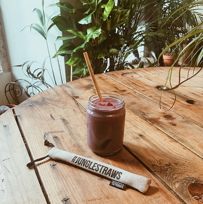 Bamboo straw and a glass smoothie jar 