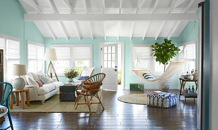 Very cozy living room with a hammock near the window