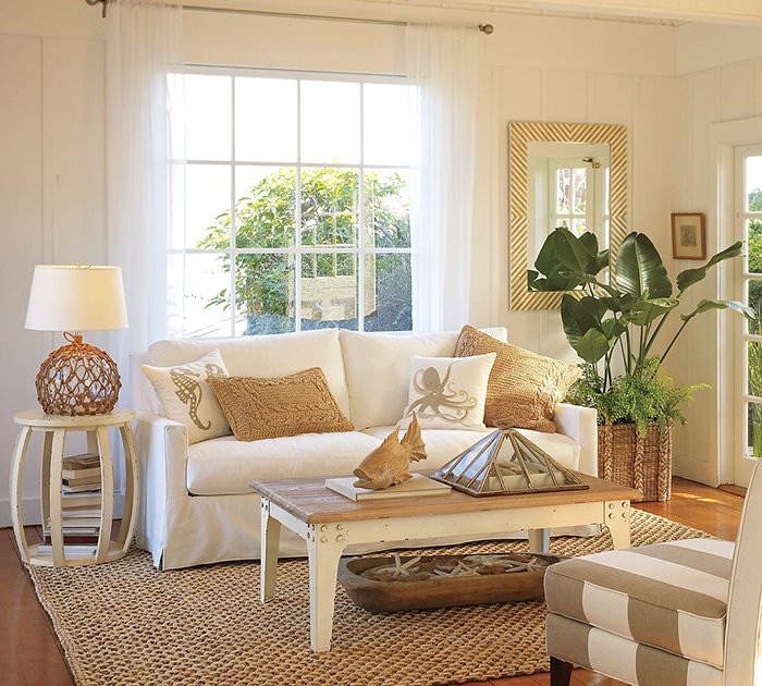 Natural fiber rug in the middle of a living room decorated with nice flowers