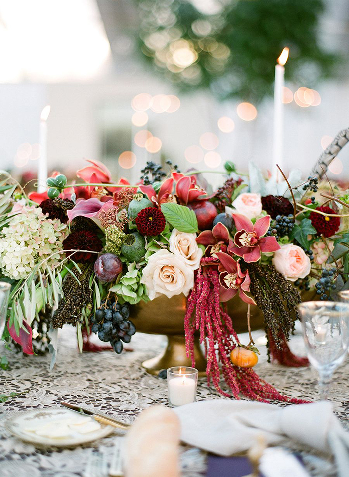 Different kinds of flowers and candles around