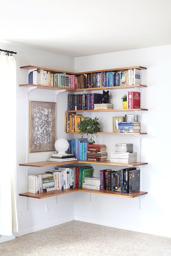 Corner bookshelf in a bedroom