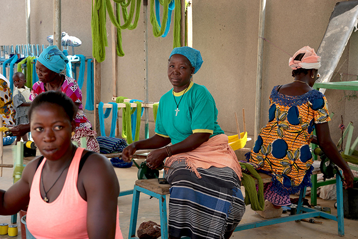 Three Afro american women making ethical clothes