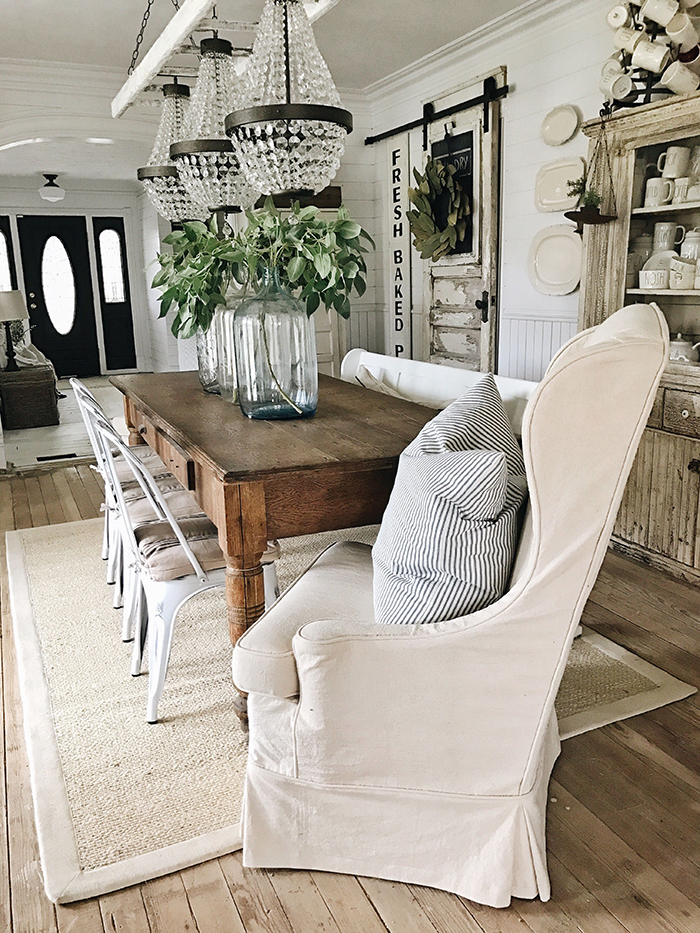 Farmhouse decor with wooden table and moder chandeliers 