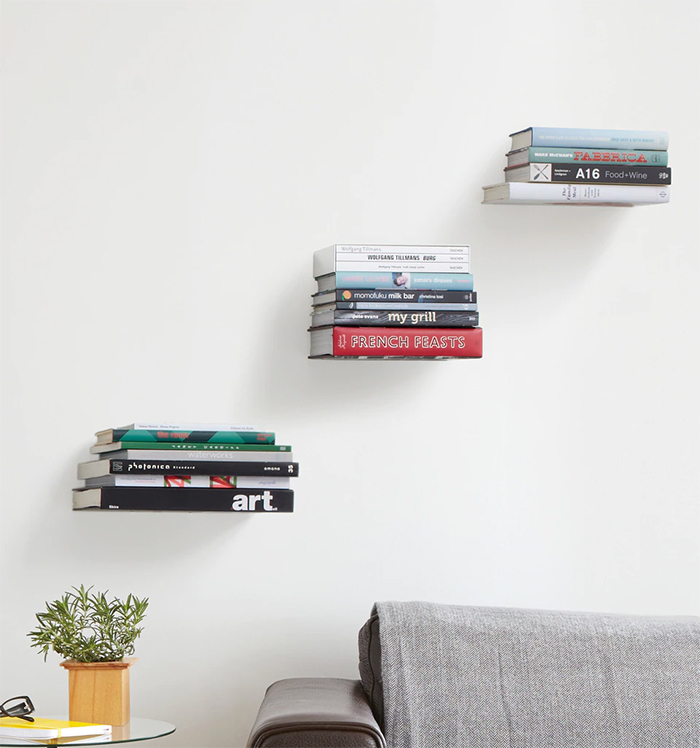 Invisible  wall bookshelves above the couch