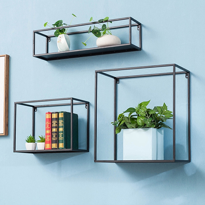 Metal square shelves with books and plants