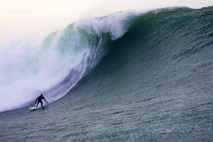 Man surfing on the waves in Ireland