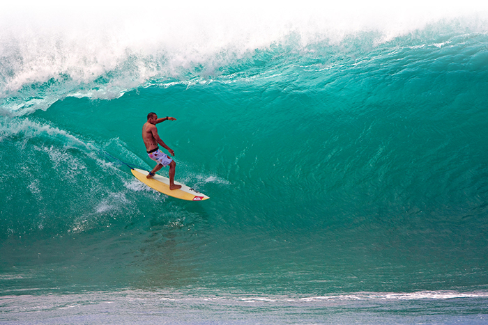 Men surfing in Hawaii