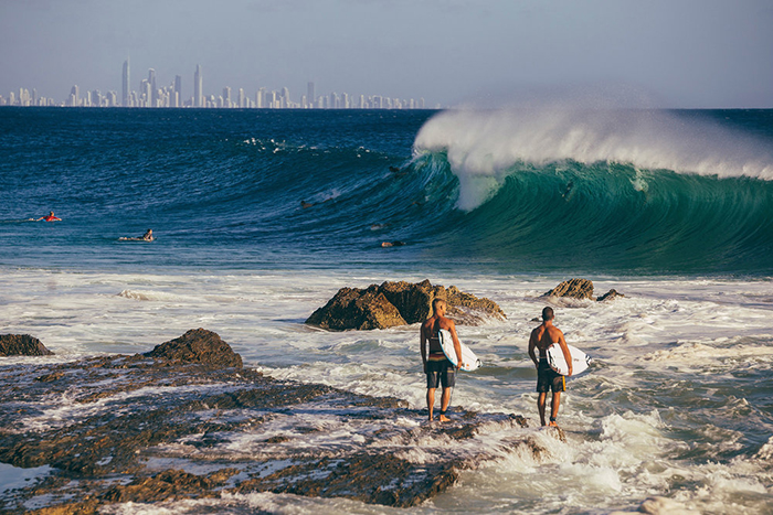 Two men with surfing desk getting ready for their surfing adventure