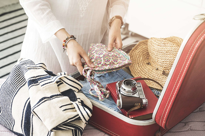 Woman packing her suitcase