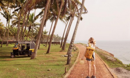 woman travelling with small yellow bagpack