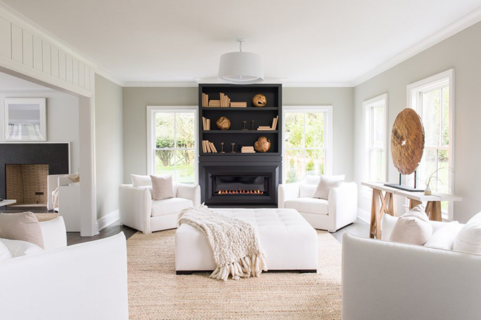 Coastal interior of a living room with a natural fiber rug