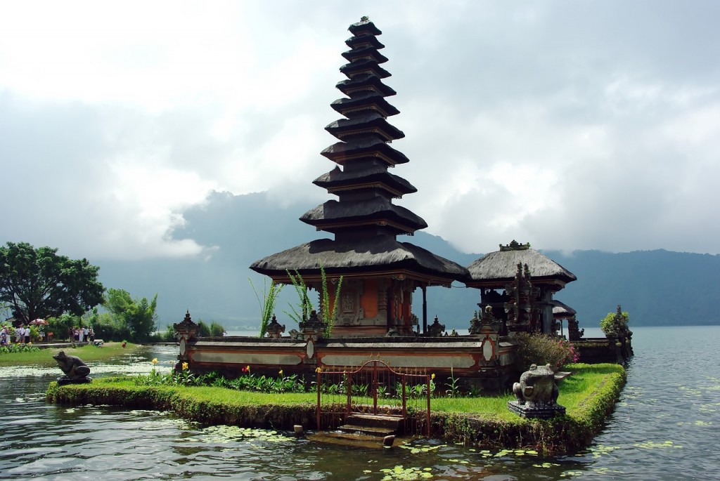 Typical house from Bali located in the sea and with a nice yard of grass around it