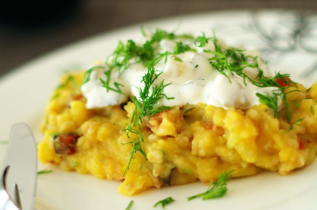 Mix of potatoes and groat with cheese and parsley on top