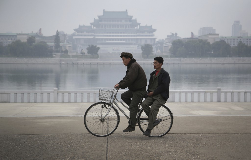 Two men on a bike 