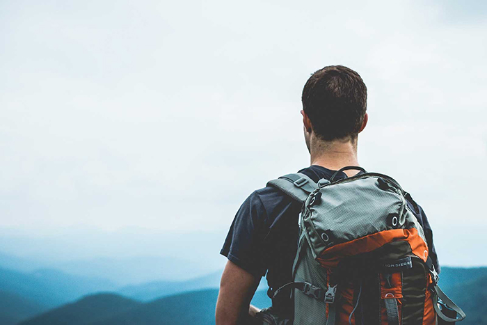 Man with a backpack enjoying a nice nature view