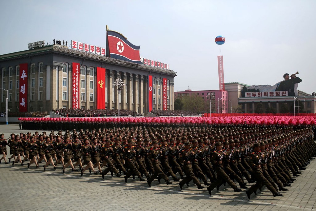 Big North Korean army with the flag behind