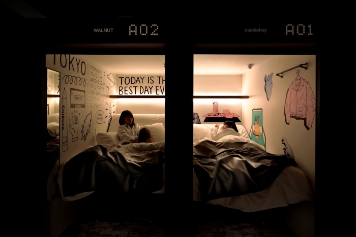 Two persons in a capsule hotel in Japan