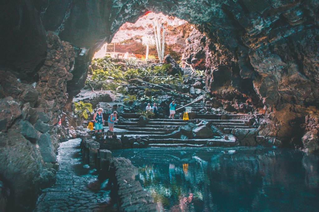 People exploring a cave in Lanzarote in island vacation