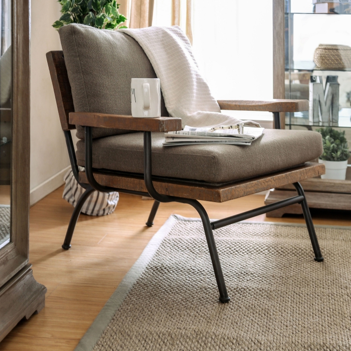 Modern chair in the living room with a coffee mug and magazines on it