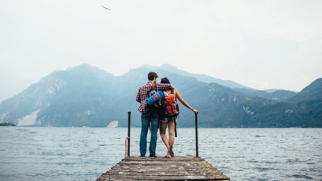 Couple standing in front of a lake